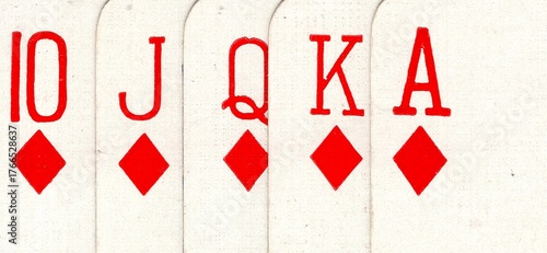 Close up detail from a poker hand of vintage playing cards.