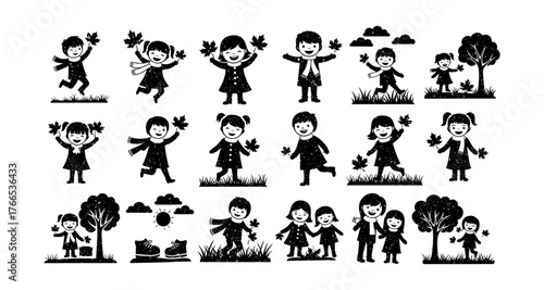 Children playing with autumn leaves silhouettes set in nature