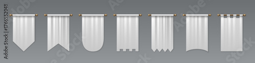 White medieval pennant set hanging on golden rods - pointed flag shapes, castle battlements, rounded bottoms and rectangular banners for heraldic display. Royal textile standards with decorative cuts.