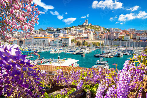 City of Marseille harbor and Notre Dame de la Garde church on the hill flower frame view