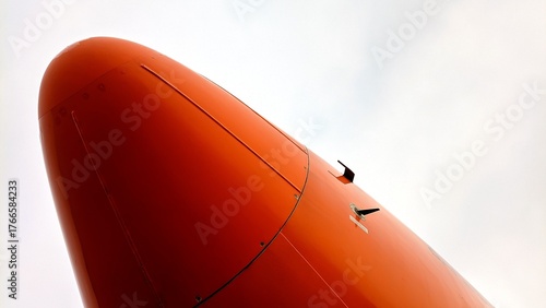 Close-up view of an aircraft radome showing the static tube and angle of attack sensor on the nose section