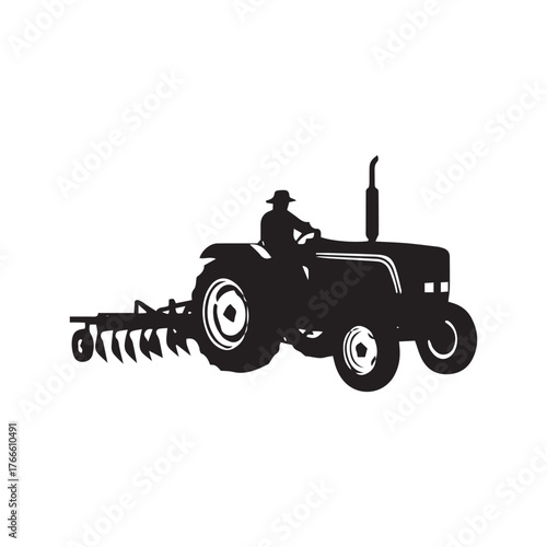 Silhouette of a farmer driving a tractor with a plow attached, ready for agricultural work in the field.