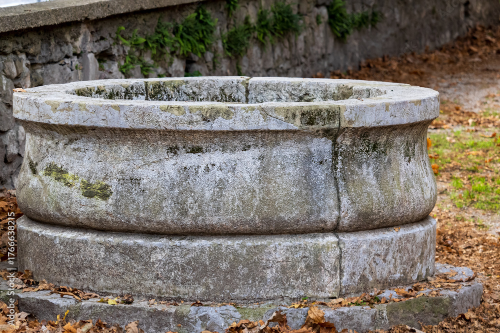 Fototapeta premium dried up a well, fountain at the crossword hall Ljubljana ( vodnjak pri krizanke ljubljana)