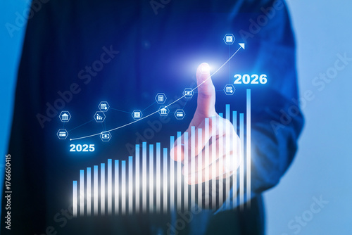 Business professional interacting with data graph showing growth projection from 2025 to 2026
