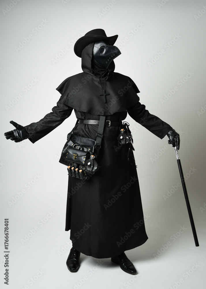Obraz premium Plague Doctor Full length walking Silhouette Portrait of Gothic Halloween Character with Beak Mask, Black Cloak on White Studio Background, Dramatic Dark Costume and Fantasy Horror figure