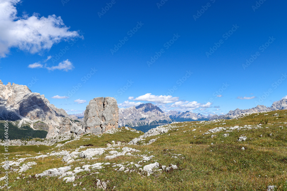 Fototapeta premium A cathedral of rock and sky—Cinque Torri watches over the highlands in quiet majesty