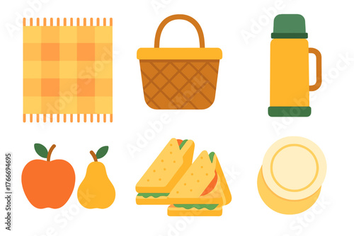 Flat lay arrangement of picnic essentials including checkered blanket, food basket, thermos, fruit, and sandwiches