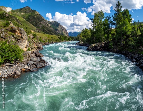 Mountain river with fast flowing rapids showing strength and movement of natural water