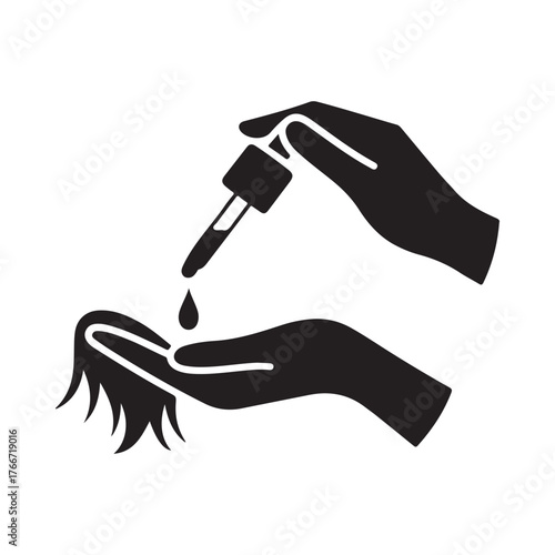 Hand applying serum or oil to hair with dropper