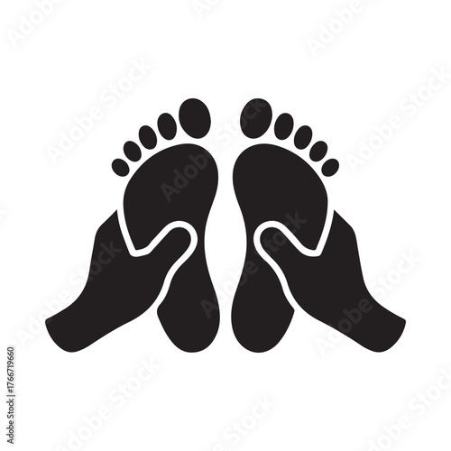 Hands massaging feet with a focus on reflexology and relaxation