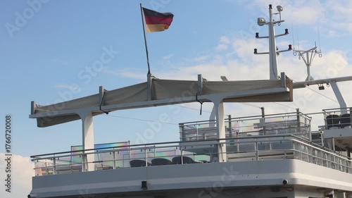 German flag waving on a cruise ship deck