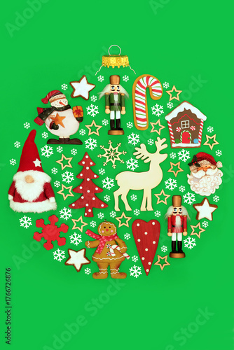 Christmas bauble tree shape decoration with old fashioned Xmas decorations on green with food and white snowflakes. Festive fun surreal concept symbol.