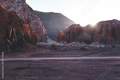 valle arcoiris canyion in atacama desert, chile, with pale golden light and red rocks