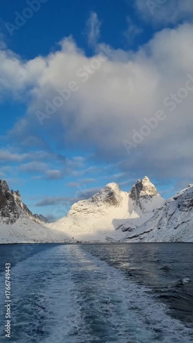 Wallpaper Mural Village of Reine in Lofoten, Norway. Overview of the village, Olstinden mountains and fjord - Reinefjord. Seafront fisherman cabins surrounding the sea.
 Torontodigital.ca