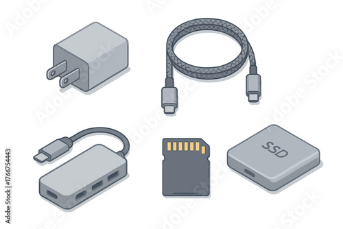 Essential computer hardware accessories set including SSD, memory card, USB cable, and power adapter