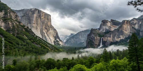 Yosemite Valley vista with El Capitan and Bridalveil Fall shrouded in mist under a stormy sky California