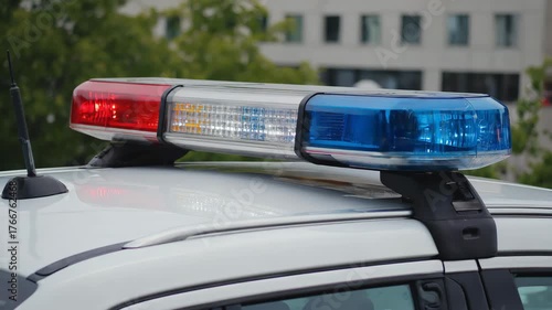 Red and Blue Flashing Siren Lightbar Mounted on Police Vehicle Roof
