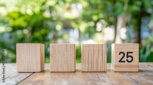 Wooden blocks on table presenting numbers with green blurred background in natural light for educational and decorative use