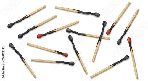 Collection burnt matchsticks scattered randomly on, some with red tips and others with black heads