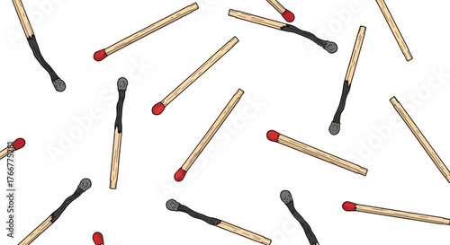 Scattered pattern wooden matches with red tips, some burnt and some unburnt, on, representing fire, ignition, and potential