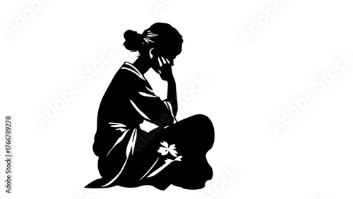 silhouette of a woman sitting on the ground, feeling sad or lost