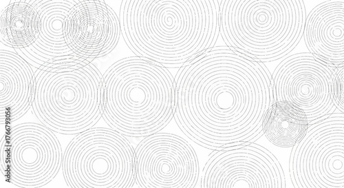 Gray and white illustration of multiple circular designs with concentric lines on a solid white background.