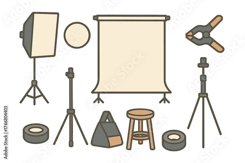 Professional photography studio equipment set including softbox, tripod, backdrop, and props