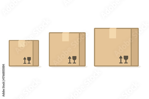 Three different sized cardboard shipping boxes sealed with tape and fragile handling symbols on a white background