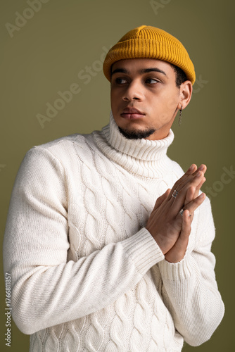 Wallpaper Mural Handsome young man showcases fashionable style with a cozy turtleneck and beanie Torontodigital.ca