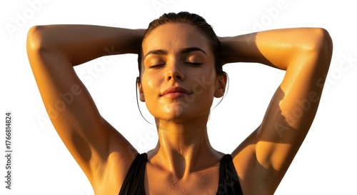 Woman relaxing outdoors with eyes closed bathed in golden sunlight