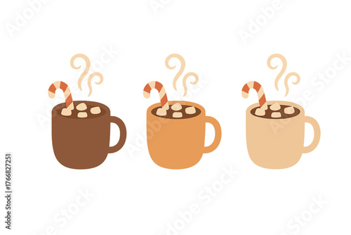 Three steaming mugs of hot cocoa with marshmallows and striped candy canes for winter holidays