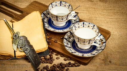 Leinwandbilder Kaffee Bar Vintage Teetassen mit Feder und Bohnen  © Vivek