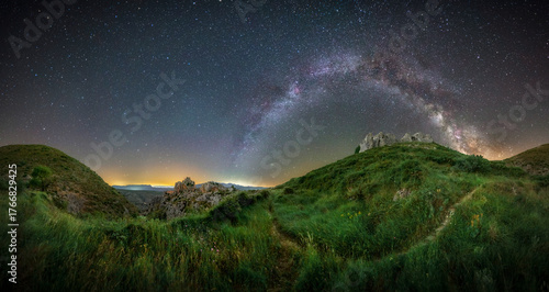 Astrophotography of the Milky Way Arching Over Mountain Valley