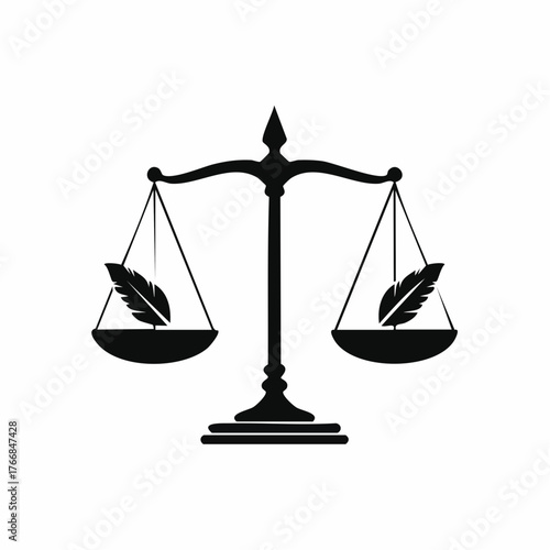 Scale of justice silhouette with quill pens symbolizing legal and fairness