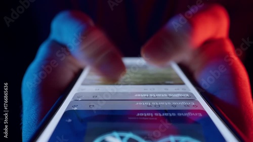 Man Rapidly Scrolls Social Media Feed with Two Fingers on Smartphone Screen Using Fast Dolly Slider Motion and Neon Light Showing the Whole Life is in the Smartphone