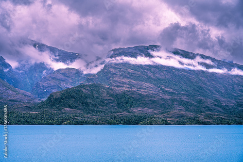 Dramatic mountain landscape with lake and moody clouds in Patagonia