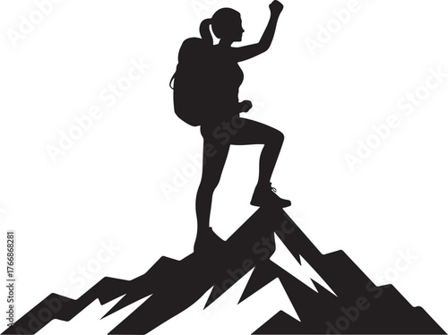 Silhouette of a triumphant female hiker reaching the summit of a mountain peak