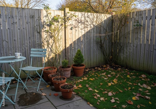Photo of a backyard of a townhouse on a sunny autumn day in a soft sunset light