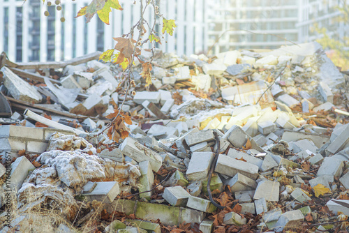 Bild auf Leinwand View of demolished building fragments illuminated by rays of sun