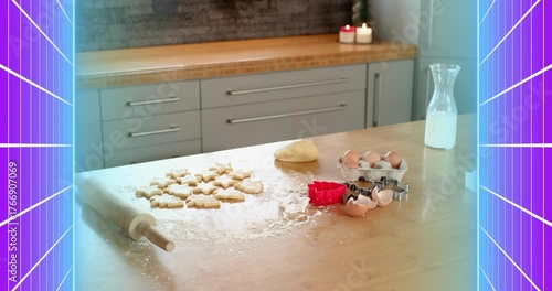 Flour dusting island while dough cutouts lying by rolling pin and cutters awaiting baking prep