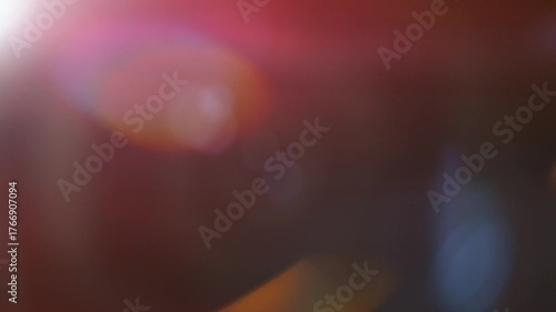 Slow motion of real lens flare through glass effects for overlay or transition