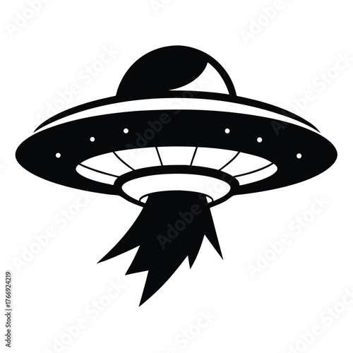 Black silhouette of classic flying saucer hovering with a beam below on a white background