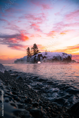 Sunrise Over Frozen Shoreline and Snow-Covered Island