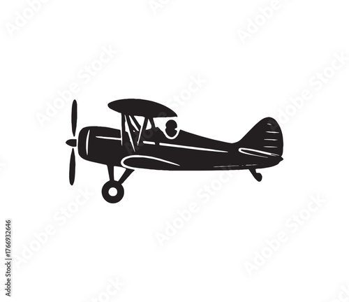 Simple black and white silhouette icon of a classic vintage biplane with a pilot in the cockpit. This retro propeller aircraft represents aviation history and the spirit of flight