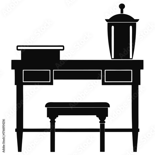 Monochrome dressing table with drawers, decorative box and stool creates a classic interior scene