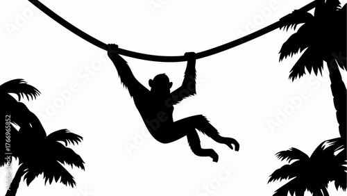 Silhouette of a monkey swinging on a vine between palm trees in a tropical jungle setting scene