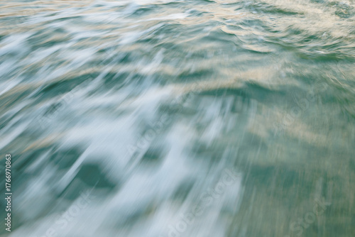 Fototapeta Naklejka Na Ścianę i Meble -  Blurred motion of ocean waves capturing dynamic flow and serenity