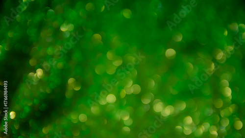Green glow. Abstract background. Light and bokeh. Abstraction circles on a black background.