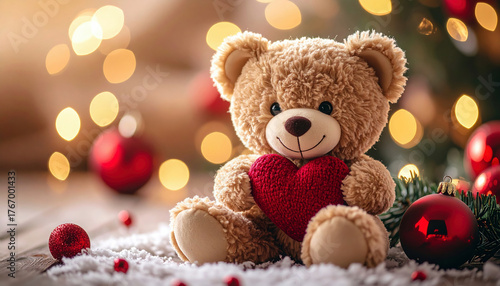 Wallpaper Mural A cute teddy bear holding a red heart sits among Christmas decorations with ornaments, pinecones, and snow, creating a warm festive holiday scene Torontodigital.ca