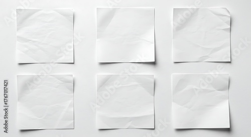 Collection of crumpled white paper sheets isolated on cream beige background